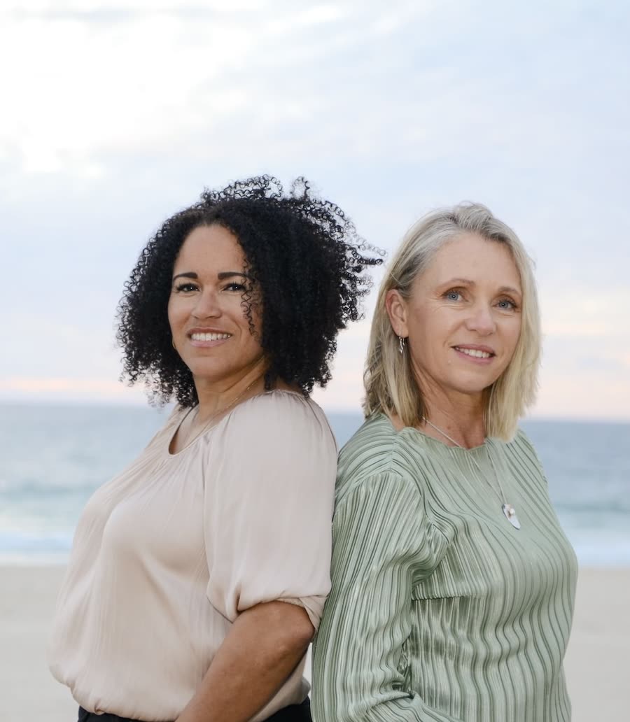 Laila Ansari and Jodie Studley on the beach at sunset